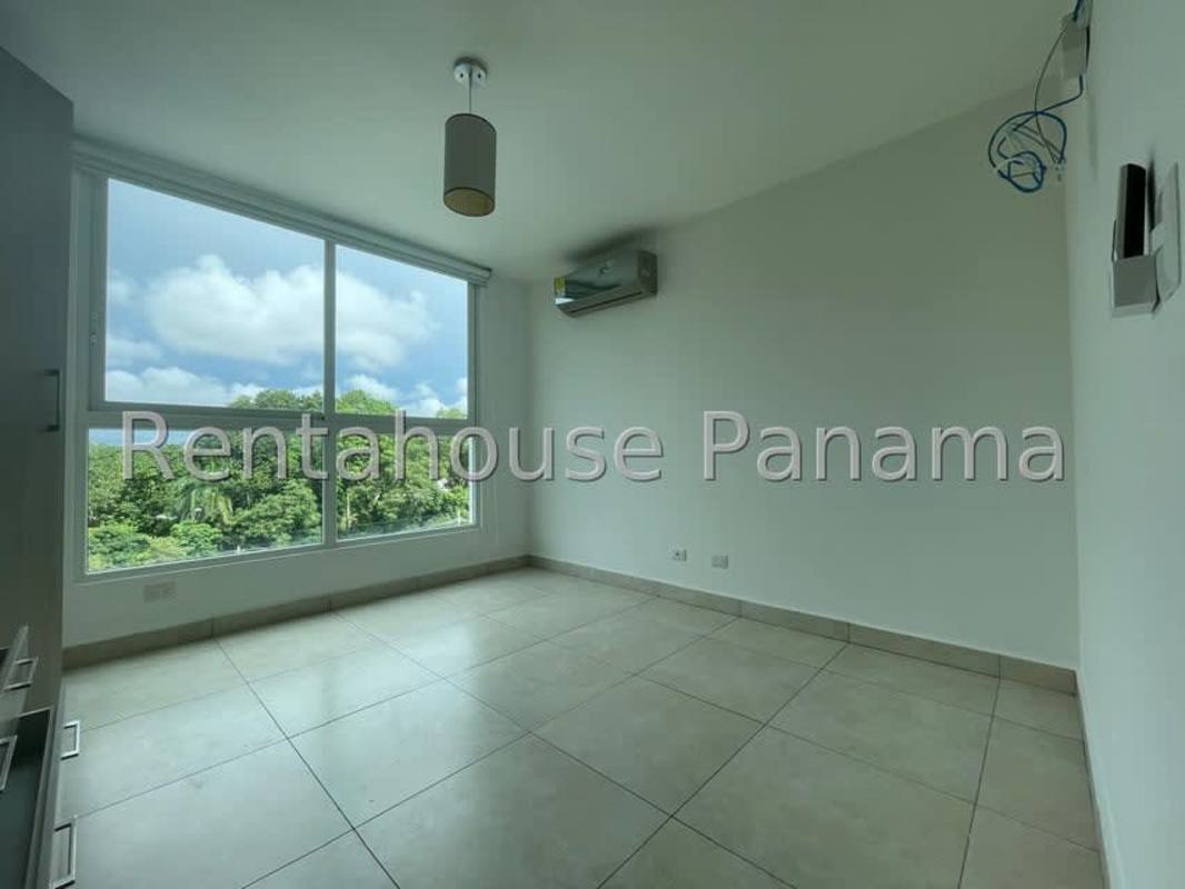 Open American style kitchen with granite countertops and appliances in Clayton Residences Panama City