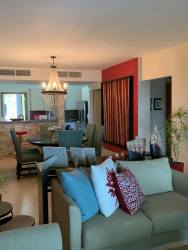 Contemporary open-plan living room with sectional sofa in beachfront condo Balboa 1 Bijao Resort Panama