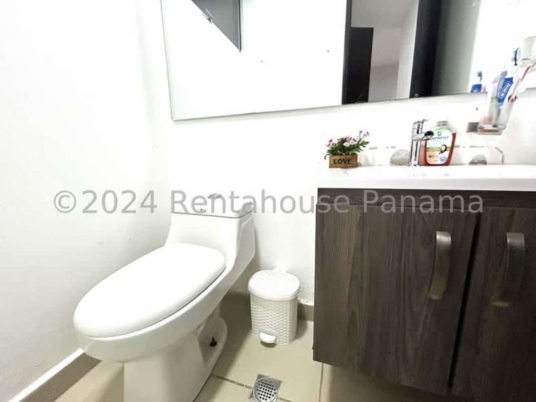Contemporary bathroom with glass shower enclosure, single sink and large mirror in Costa Sur Panama City