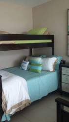 Beach style bedroom with ocean decor fully furnished in Bijao Balboa Tower Panama