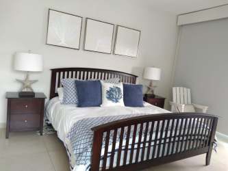 Fully furnished bright bedroom with ocean style decor in Bijao Beach Resort Panama