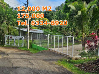 Large lot with fence surrounded by greenery near Capira Panama City outskirts