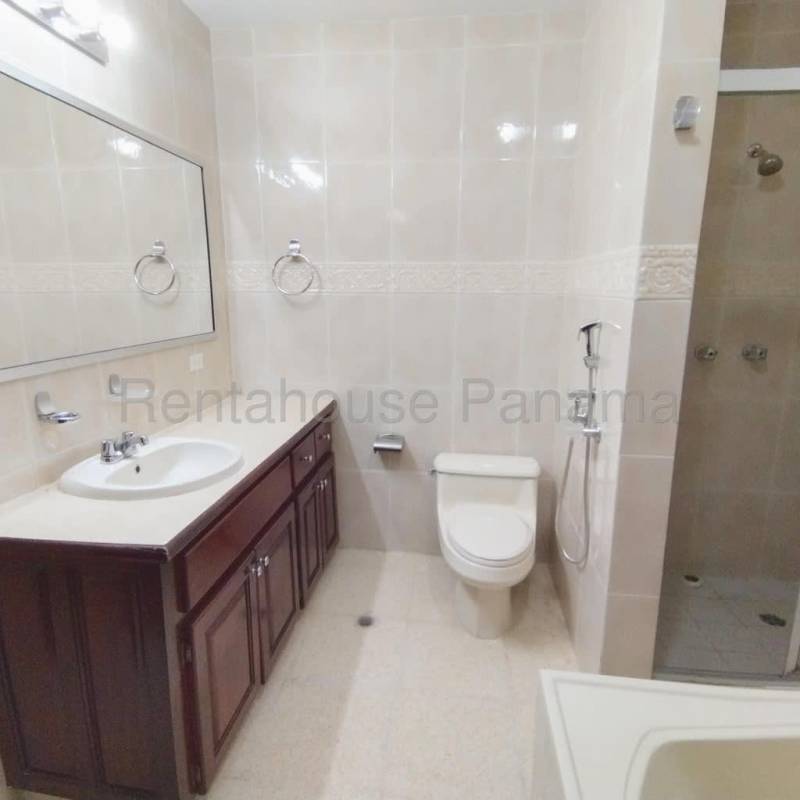 Elegant front entrance with arched window and double wooden doors in Costa del Este rental house Panama