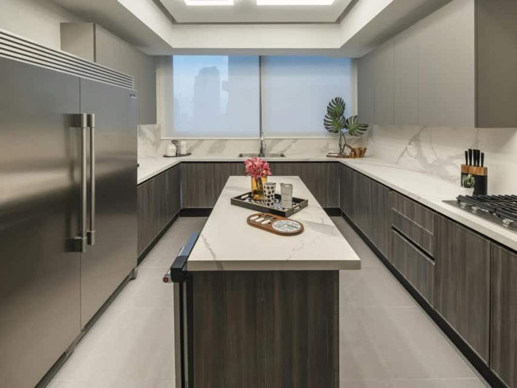 Gourmet kitchen with marble countertops, stainless appliances, island at PH Pacific Point Punta Paitilla
