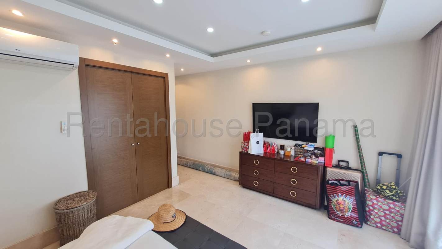 Spacious modern living room with balcony and view in The Reserve Panama City