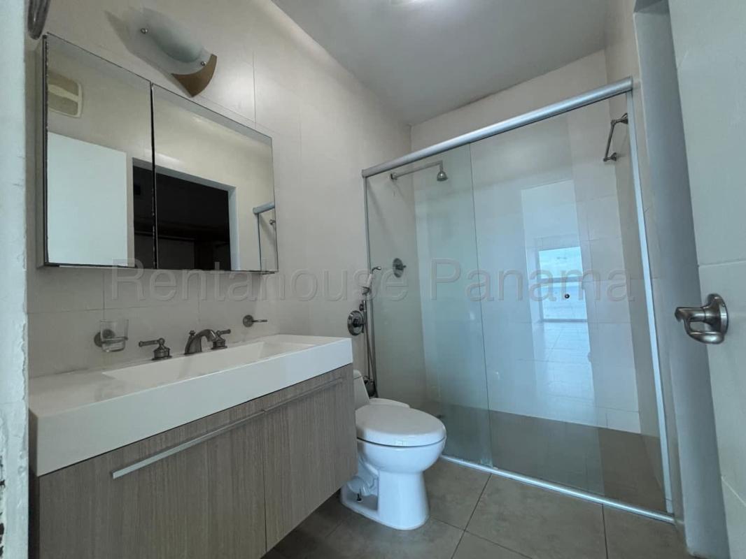 Modern bathroom with glass shower and granite vanity PH BICSA Tower Panama City