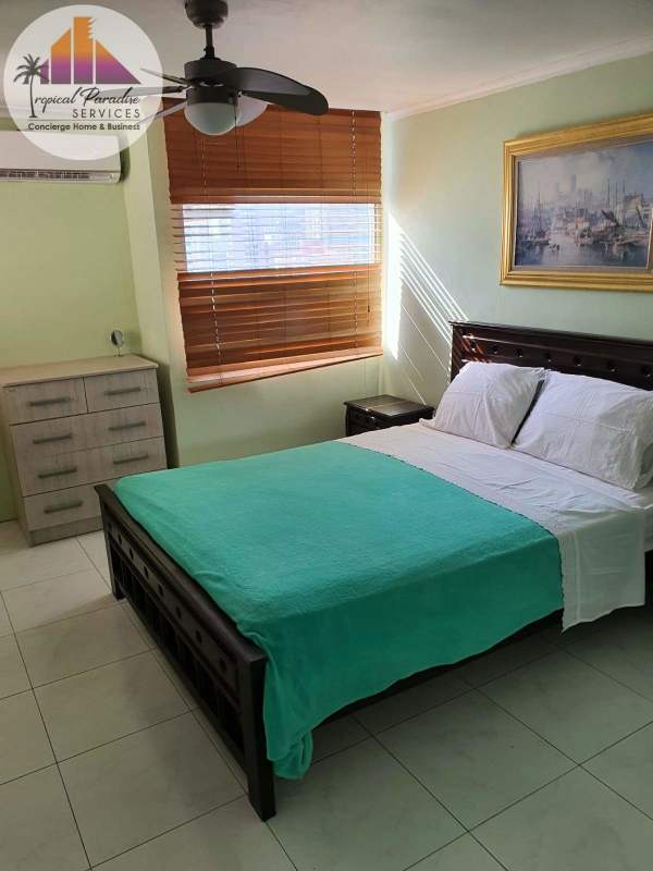 Bright bedroom with closet and large window at PH Cristal Park Via Argentina