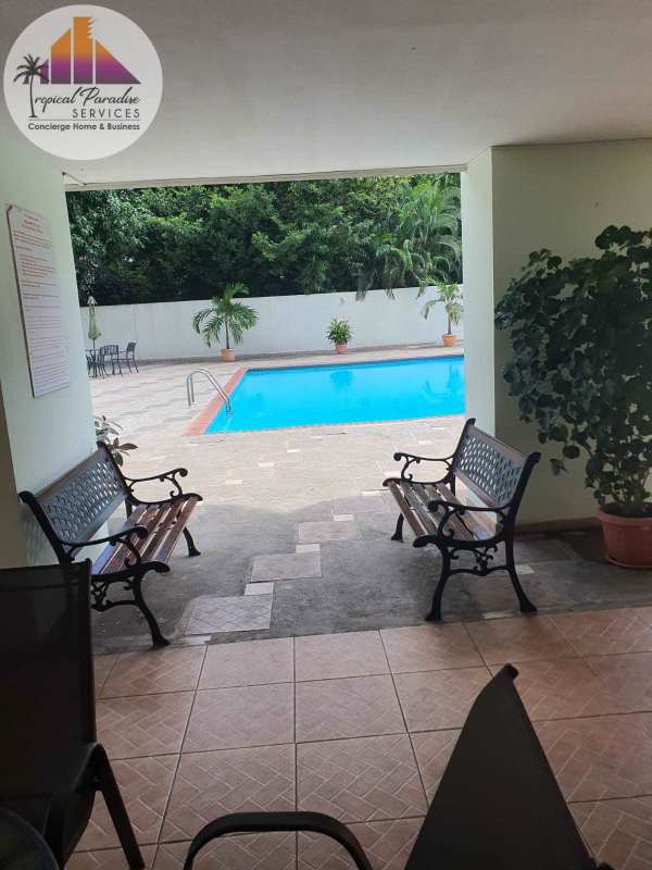 Condo pool with sun loungers at PH Cristal Park Via Argentina El Cangrejo Panama