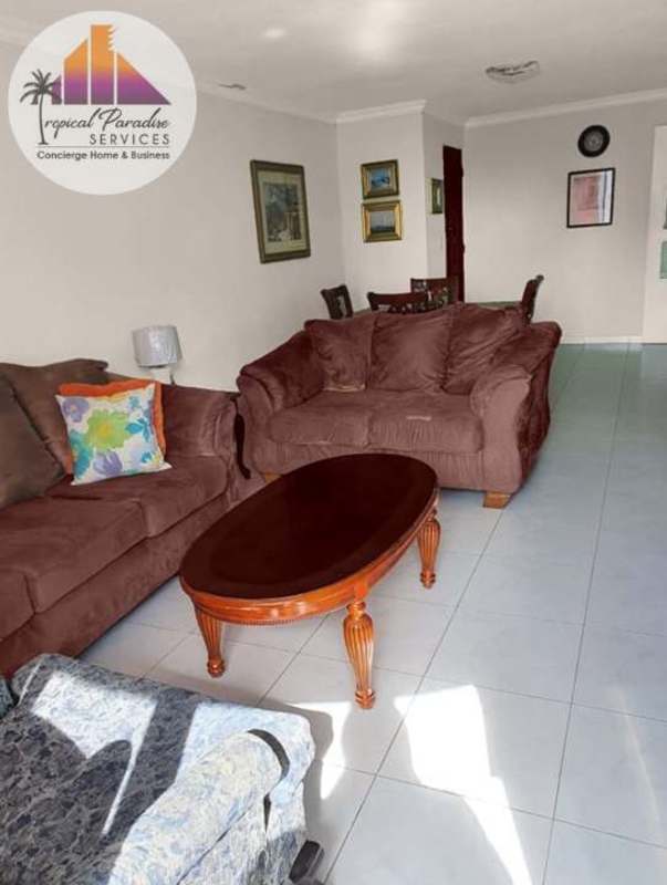 Living-dining area with balcony access at PH Cristal Park Panama