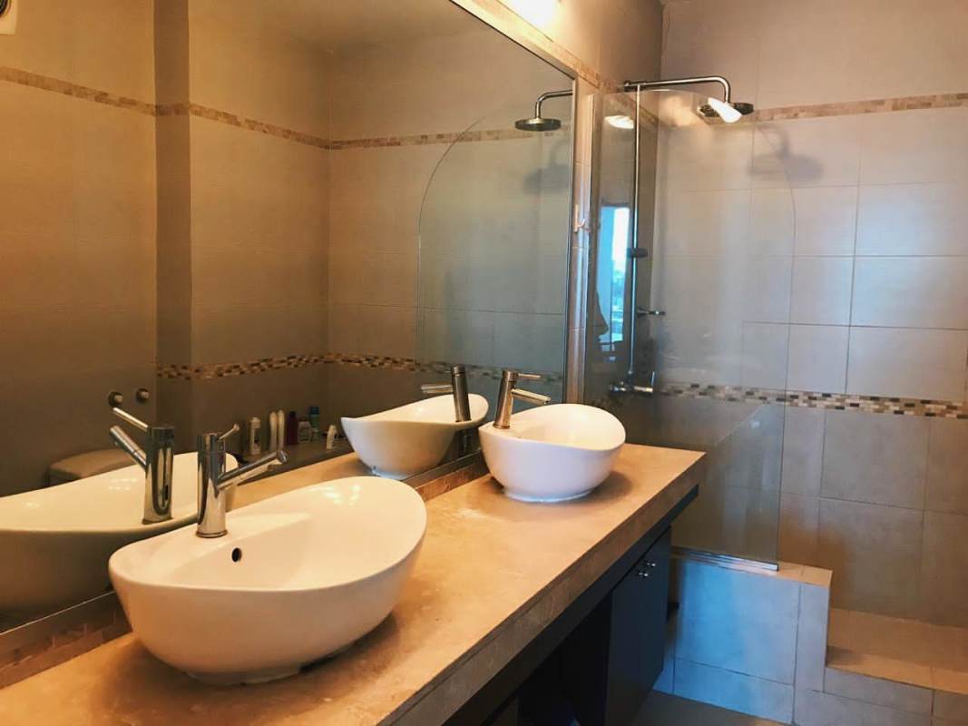 Modern bathroom with glass walk-in shower granite vanity PH Destiny Panama City