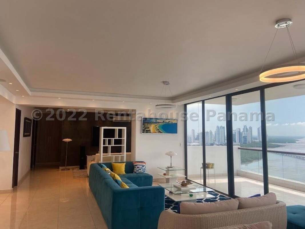 Dining space with large windows and city view at PH Dal Mare Coco del Mar Panama