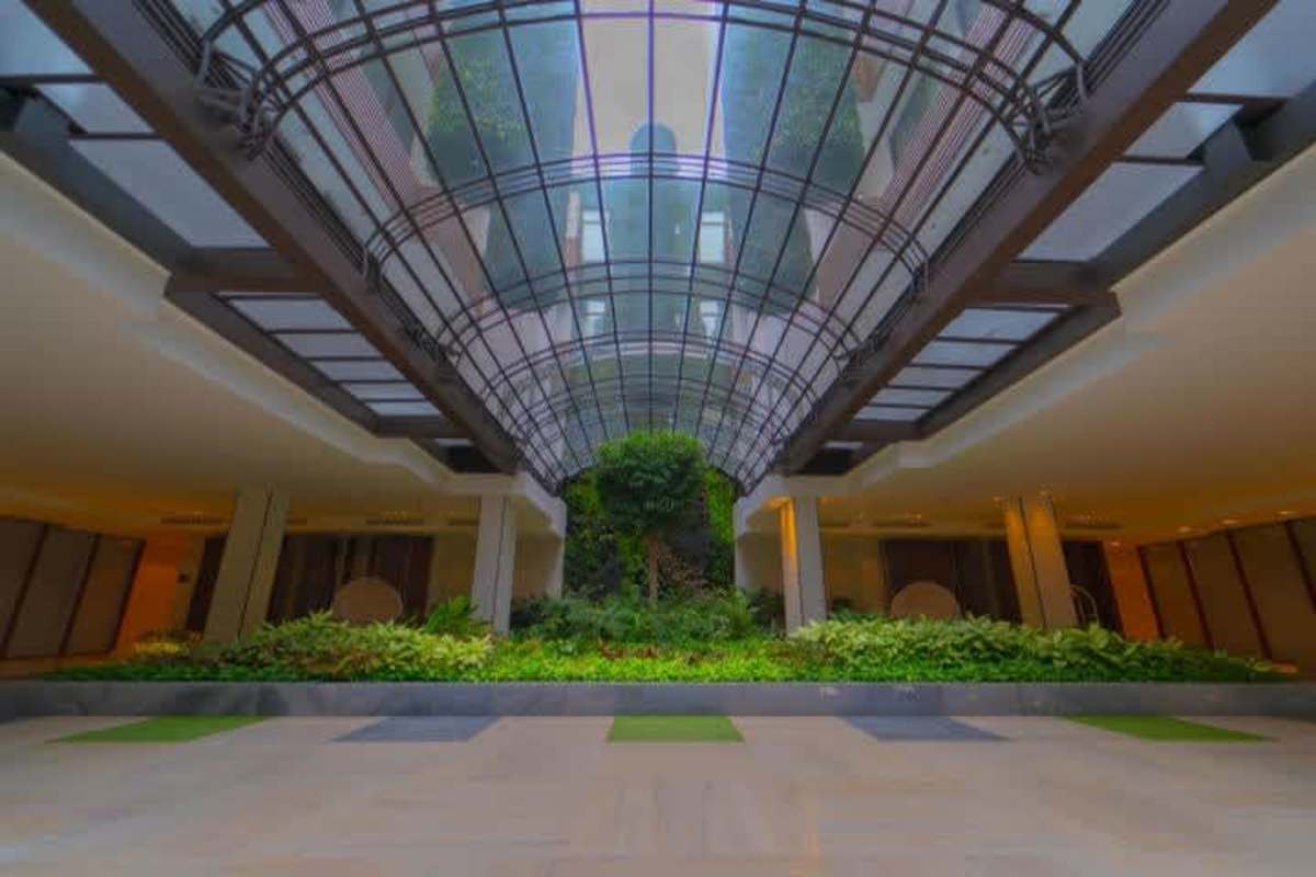Large living room with marble floors, floor-to-ceiling windows and Pacific Ocean views