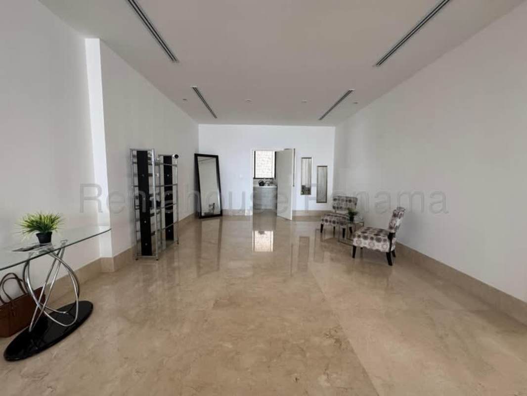 Elegant bathroom with double sink vanity, soaker tub and marble accents