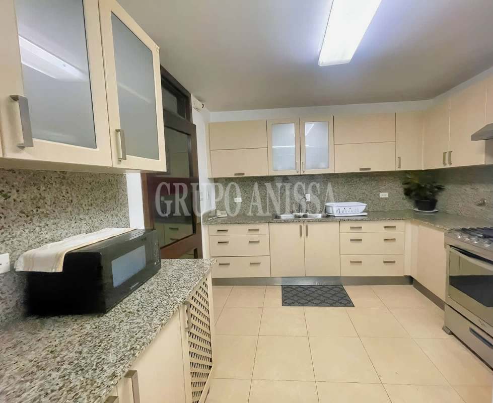 Spacious kitchen with granite countertops, stainless steel appliances at PH Parque del Mar