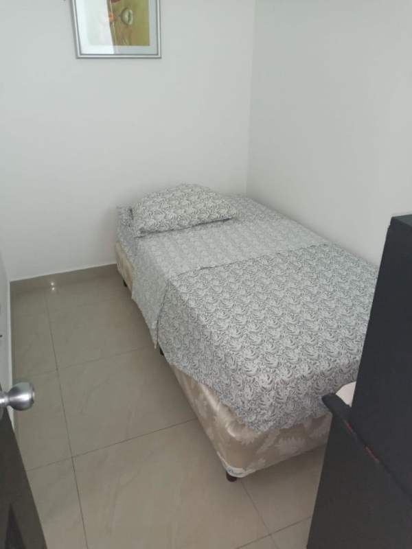 Minimalist small bedroom with tiled floors and simple decor Punta Paitilla Panama