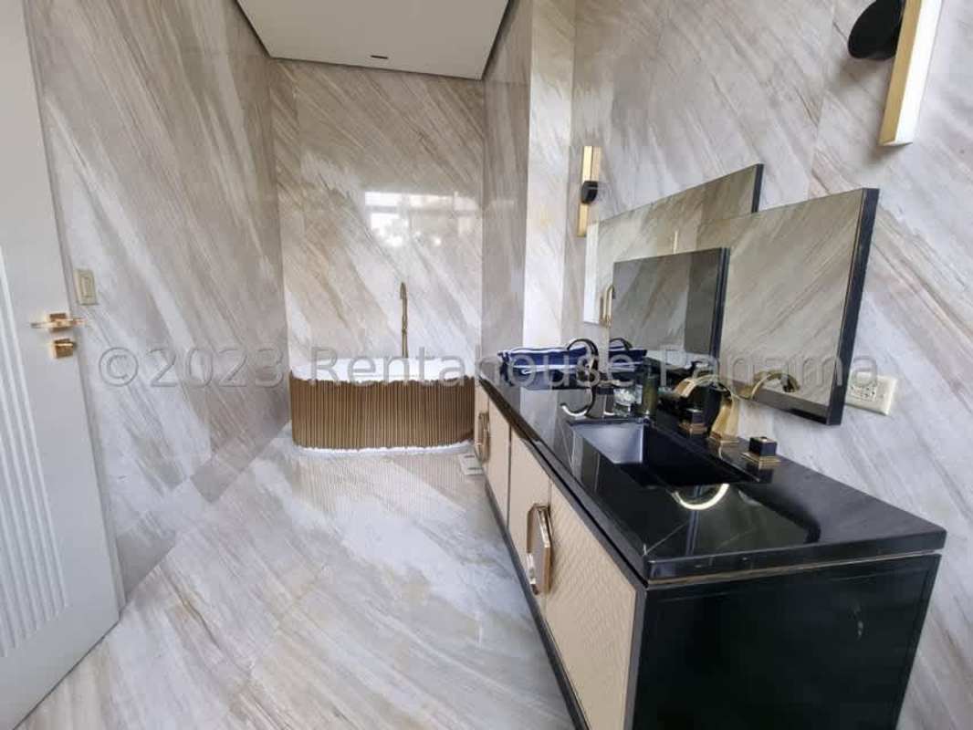Luxurious marble bathroom with double sinks and freestanding tub in Ocean Reef Panama