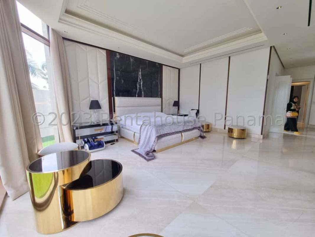 Contemporary master bathroom with black marble, gold accents, large windows Ocean Reef Islands