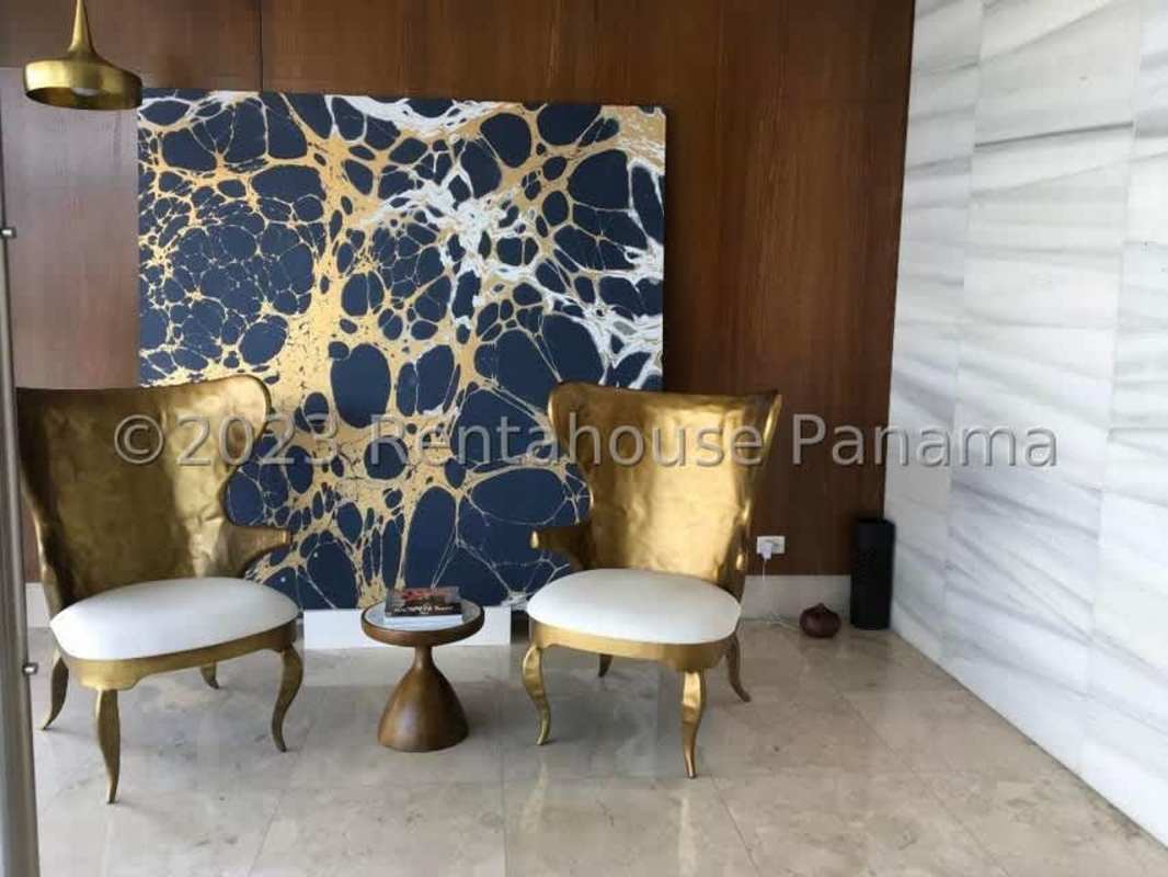 Elegant reception lobby with marble flooring and gold furniture Ocean Reef Islands Panama
