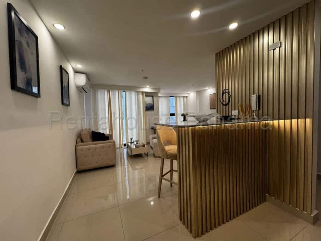 Modern open kitchen with granite countertop and breakfast bar in Obarrio apartment Panama