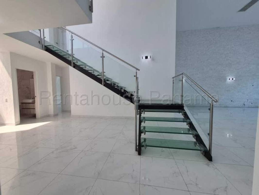 Modern bathroom with marble tiles, glass-enclosed shower, vessel sink Costa Sur Panama