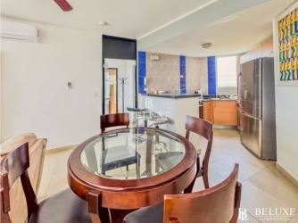 Dining area with large windows ocean view penthouse PH Founders Playa Blanca Panama