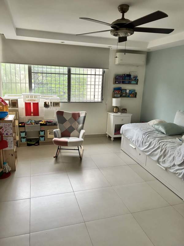 Kids room with bed and fan bright window PH Diplomático Obarrio Panama