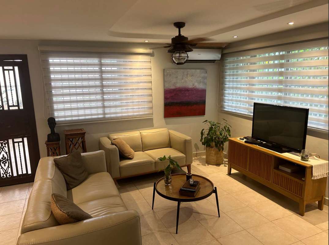 Large living and dining room with natural light ceramic tile floor in house for sale Condado del Rey Panama