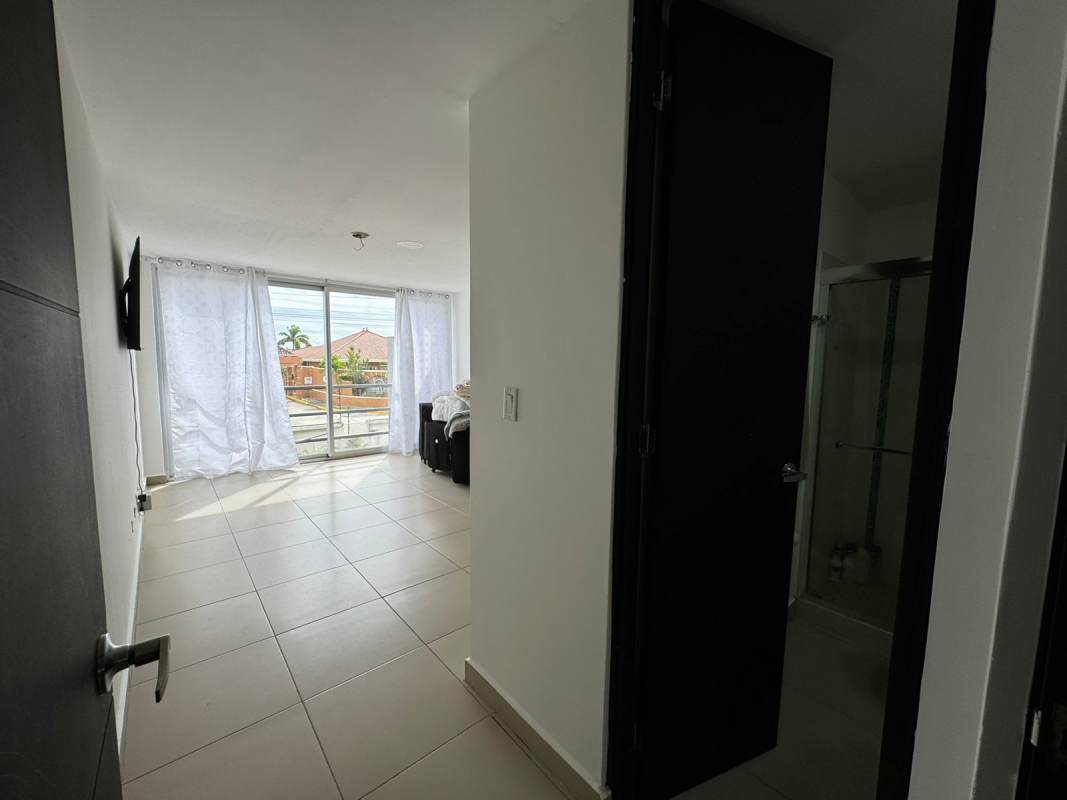 Modern kitchen with granite countertops, built-in appliances and breakfast area in Costa Sur Village furnished house