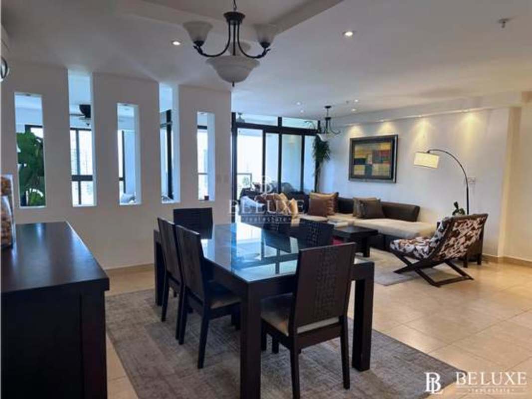 Spacious dining area with large windows and tile floors at PH Parque del Mar II Costa del Este Panama