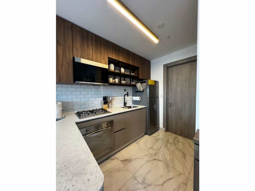 Furnished bedroom with en-suite and city view window PH The Gray Panama