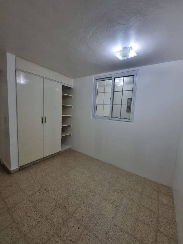 Apartment hallway with tile floor and white walls in Panama City rental Bella Vista