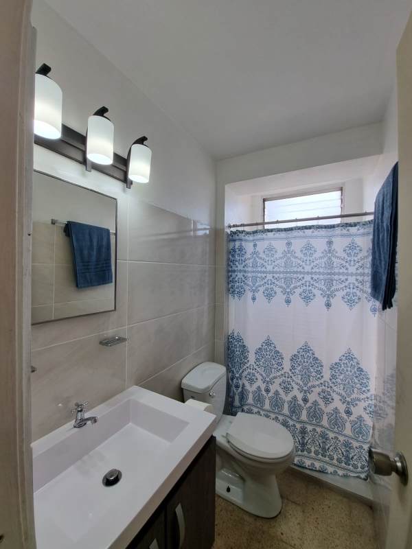 Bathroom with ceramic tile and vanity in apartment rental Bella Vista Panama