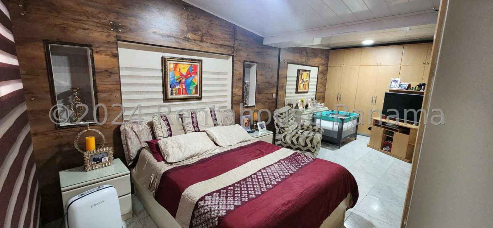 Cozy master bedroom with tufted headboard, pink feature wall, air conditioning Pueblo Nuevo Panama
