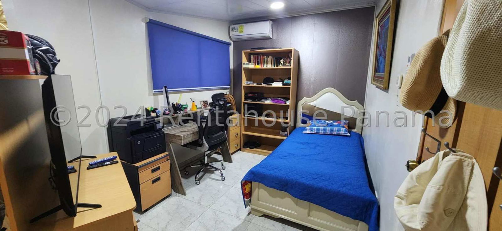 Traditional dining room with wall mirror, wood shelving and decor in Panama house