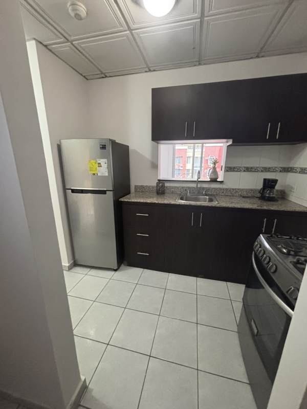 Bright furnished living dining area with balcony access in Torres de Milan Condado del Rey Panama City