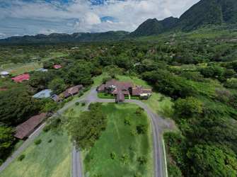 Spacious traditional kitchen with wood cabinetry, garden view, and natural lighting luxury estate Panama