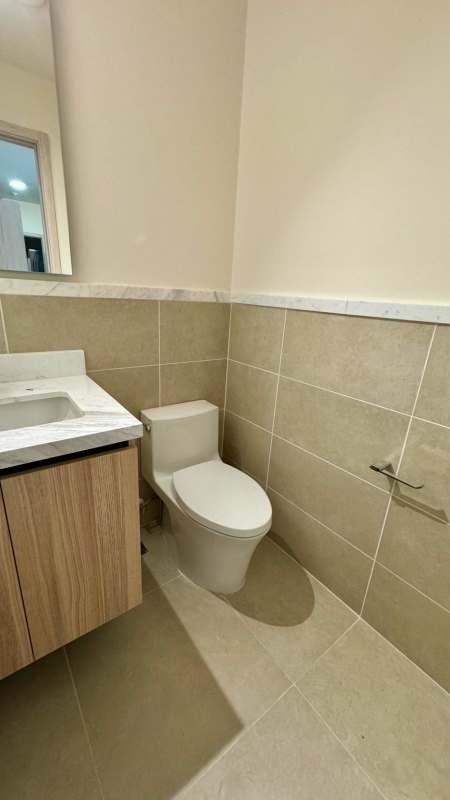 Spacious walk-in closet with custom shelving and lighting in PH Ocean House Santa Maria