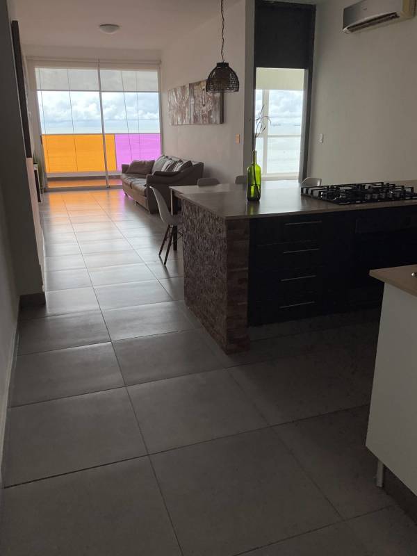 Modern living area with balcony ocean view in PH Element Tower Avenida Balboa Panama