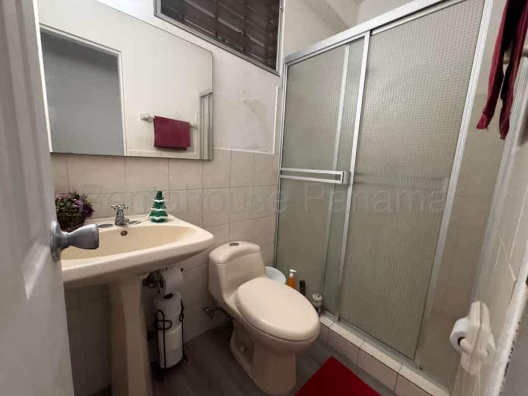 Kitchen with mosaic backsplash wood cabinetry in Villa Lucre Panama house for sale