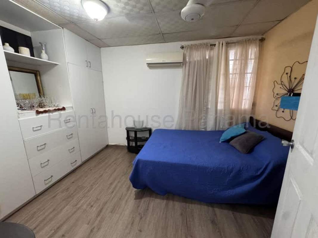 Large bedroom with tile floors built-in wardrobe AC and ceiling fan in Villa Lucre house Panama