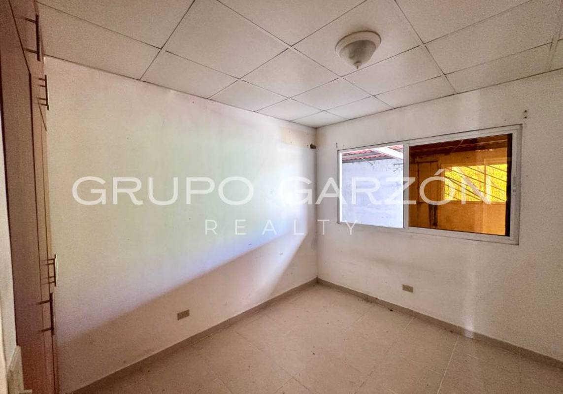 Unfinished construction room with concrete walls ideal for future master suite or terrace