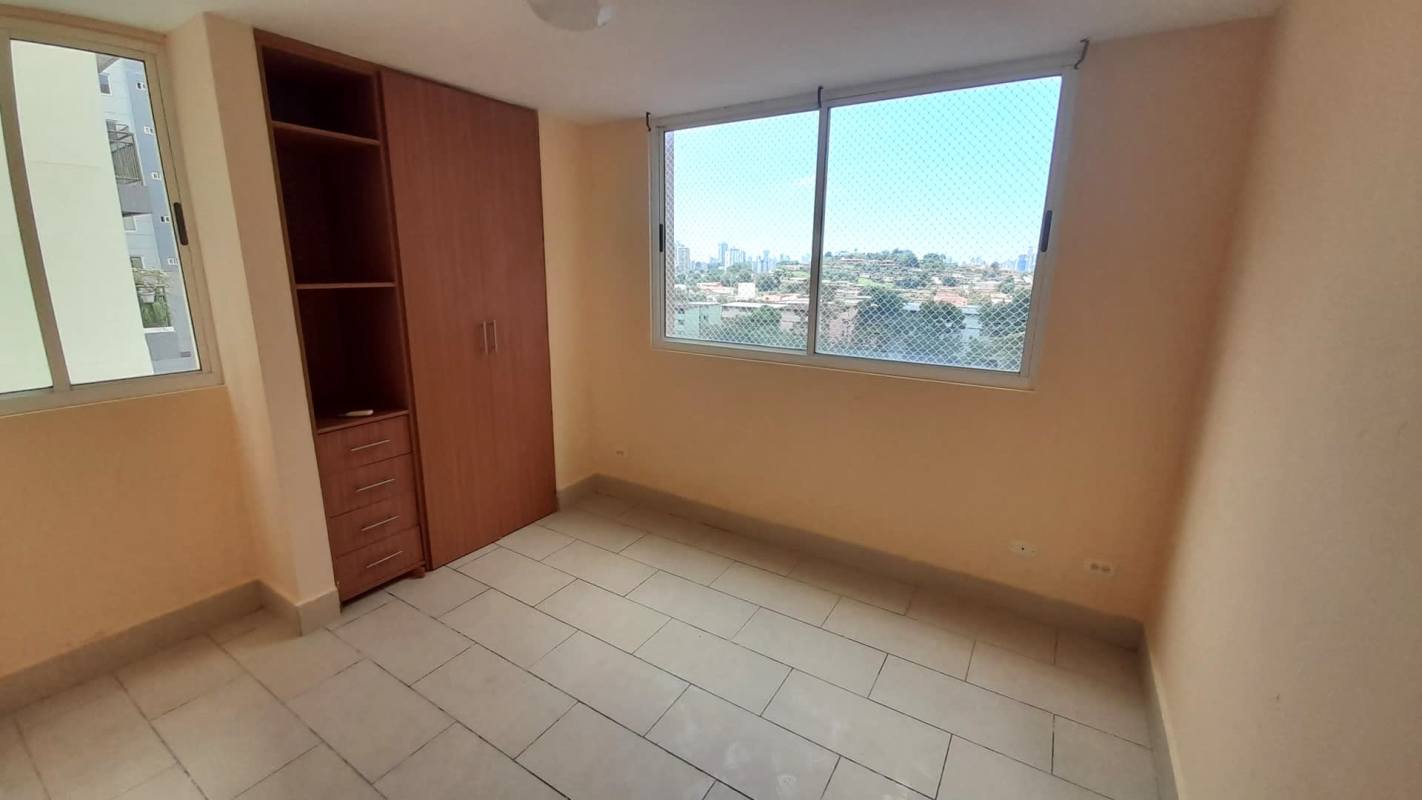 Living room with sliding doors opening to balcony PH Met View Villa de las Fuentes Panama City
