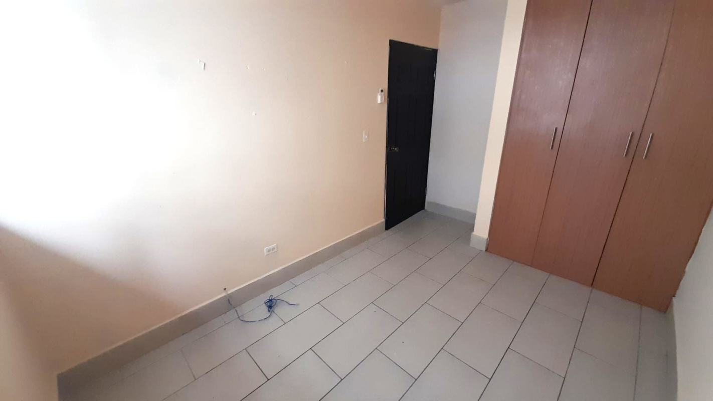 Bedroom interior with built-in wooden wardrobe PH Met View Villa de las Fuentes Panama