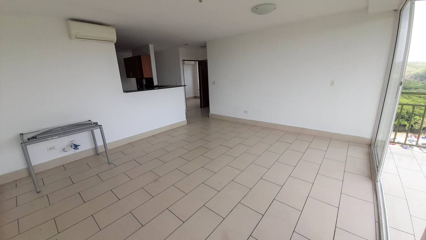 Spacious living room with large glass doors to balcony in PH Met View Panama