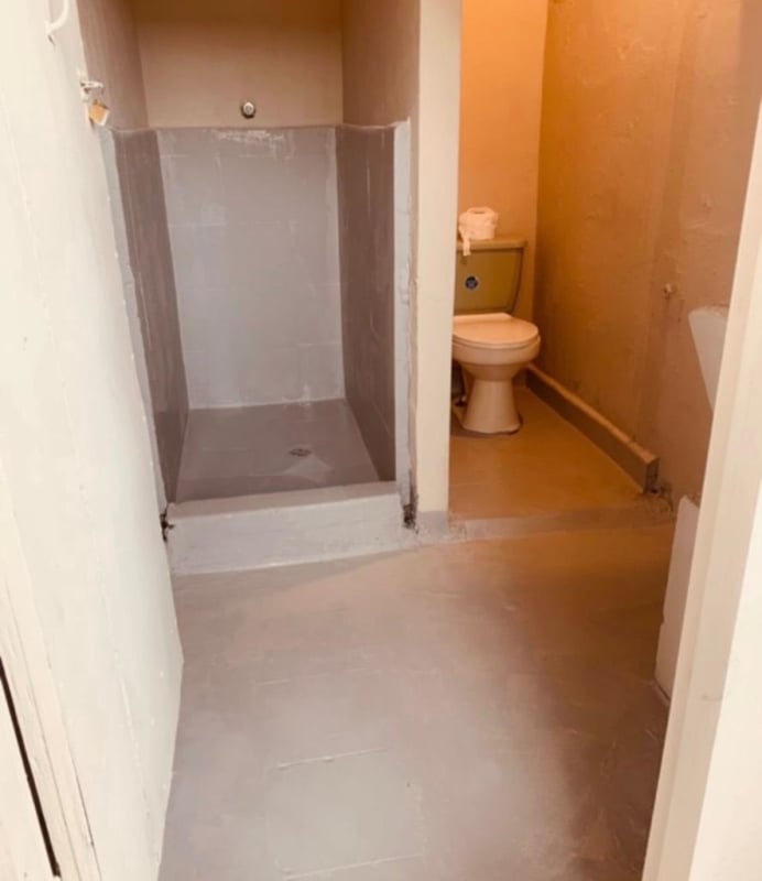 Unfinished budget bathroom with walk-in shower and toilet in studio apartment rental Llano Bonito Don Bosco Panama