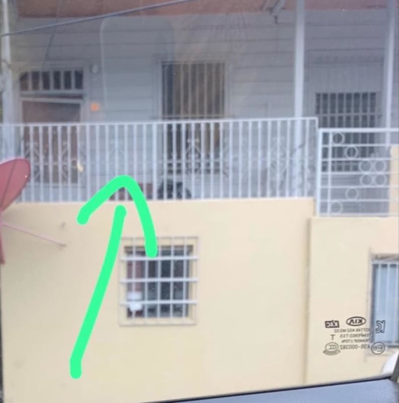 Patio area with beige walls, barred windows, small balcony two-story apartment in Llano Bonito Don Bosco Panama