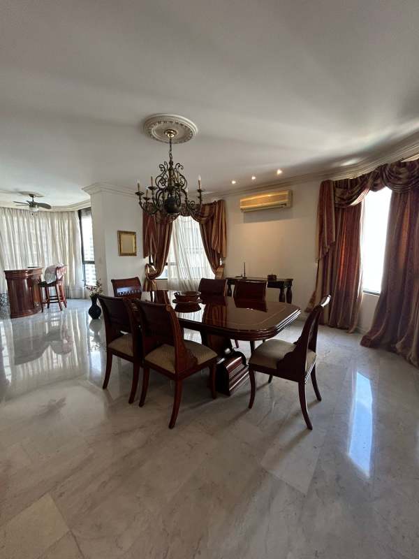 Classy dining room with chandelier and marble floors at PH Regent Punta Paitilla Panama