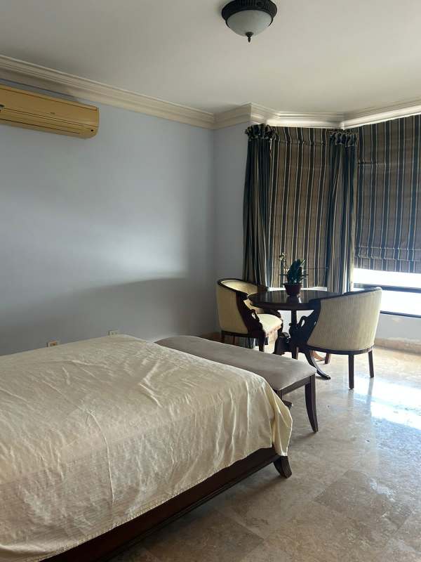 Spacious traditional master bedroom with ornate furniture at PH Regent Punta Paitilla