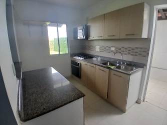 Secondary bedroom with window and ceramic flooring in Crown Hills Costa Verde