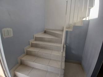 Modern kitchen with granite countertops and cabinets in rental house Costa Verde Panama